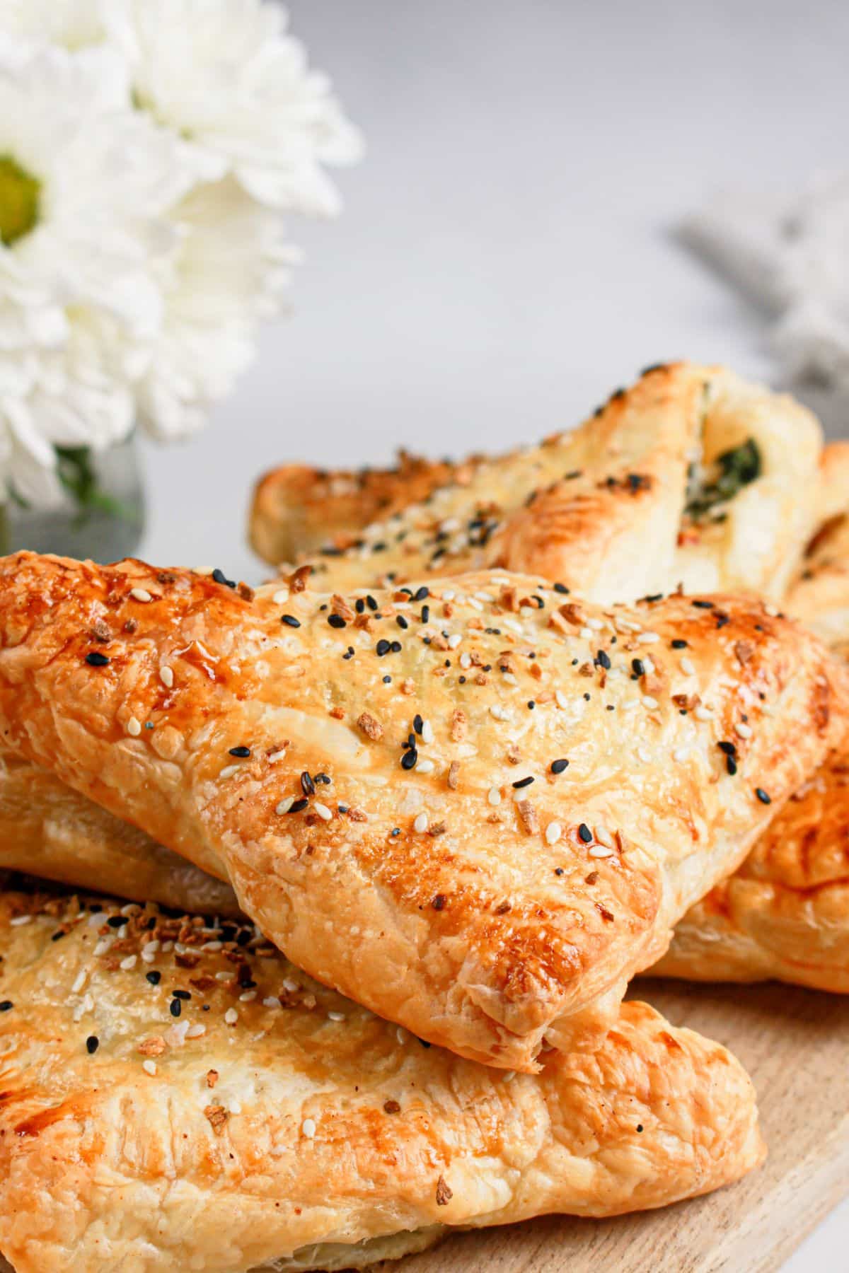 Cheese spinach puff pastries on a plate.