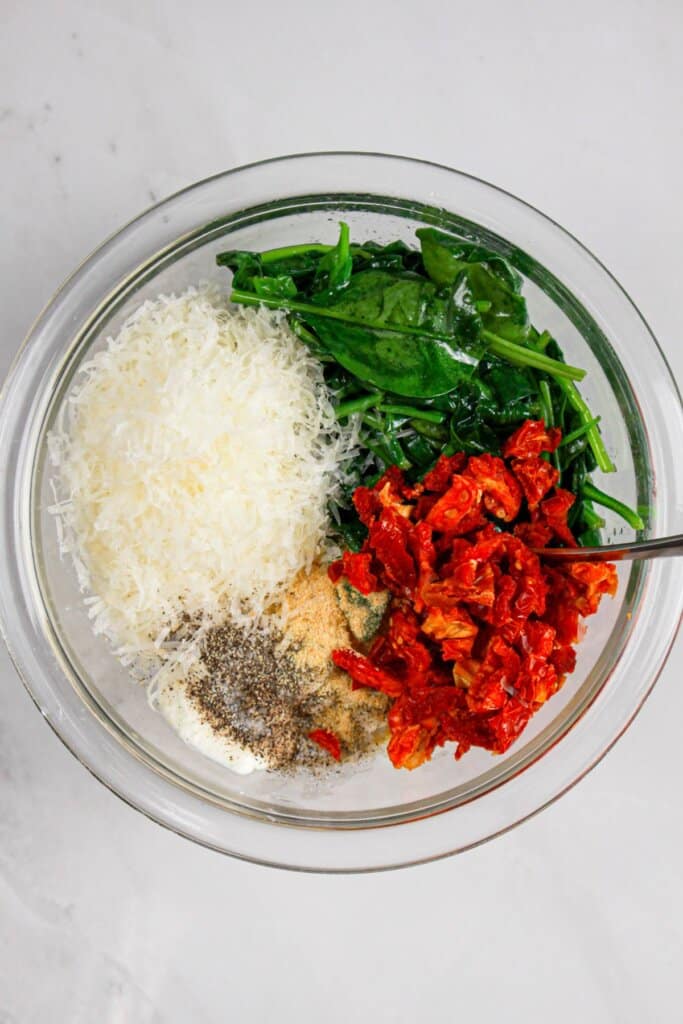 Filling being mixed together in a bowl.
