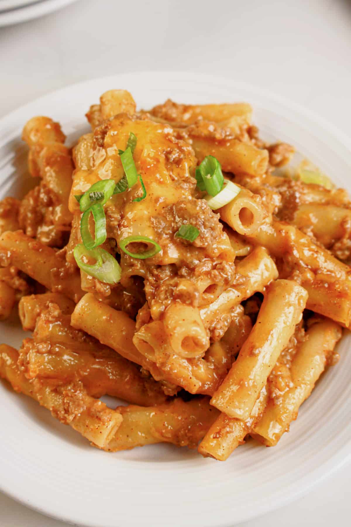 Small plate of cheesy taco pasta bake.