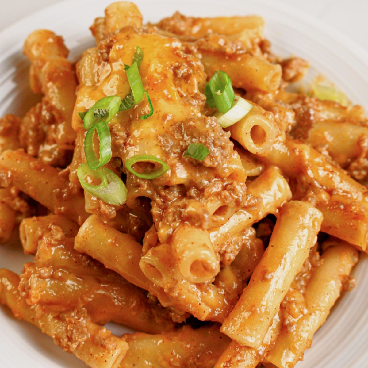 Small plate of cheesy taco pasta bake.