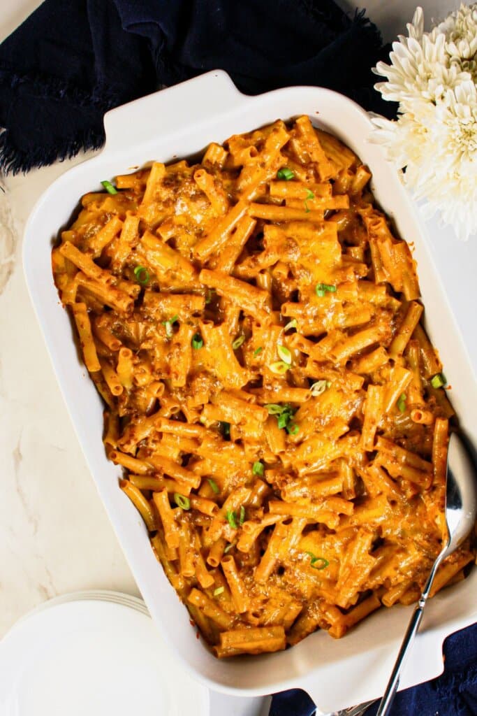 Casserole full of cooked noodles.