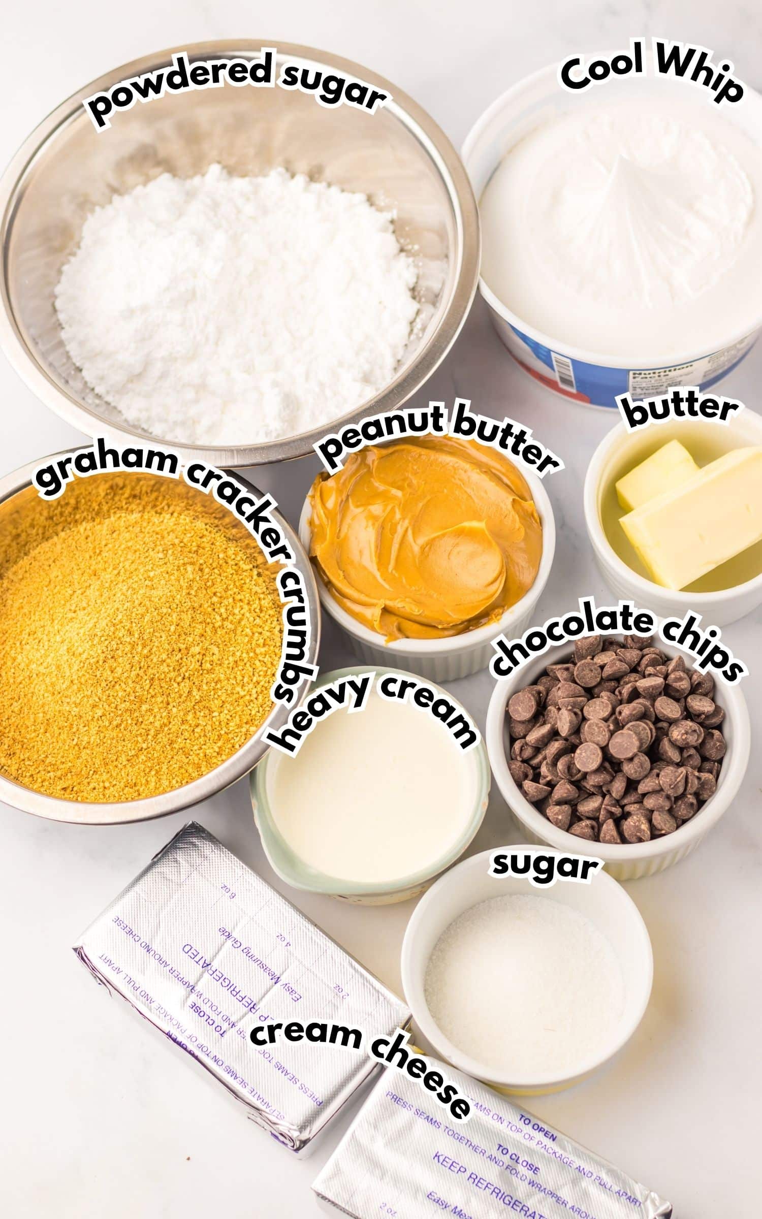 Bowls of ingredients labelled with text on a counter.