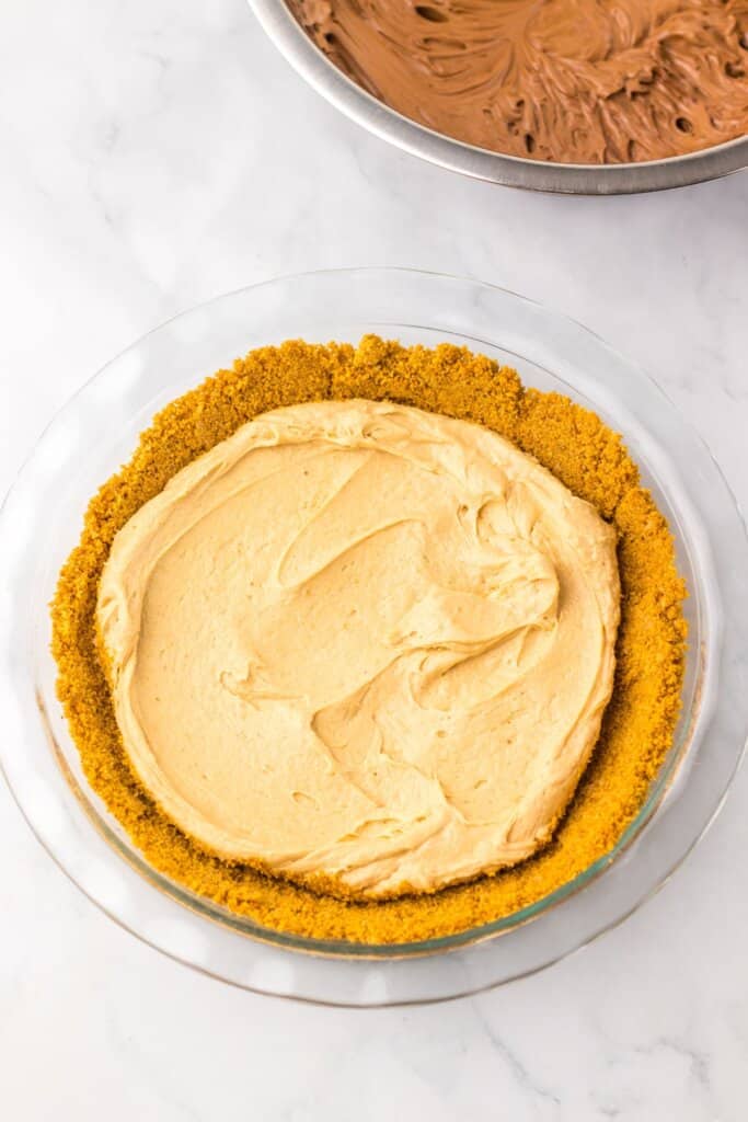 Filling being added on top of crust.