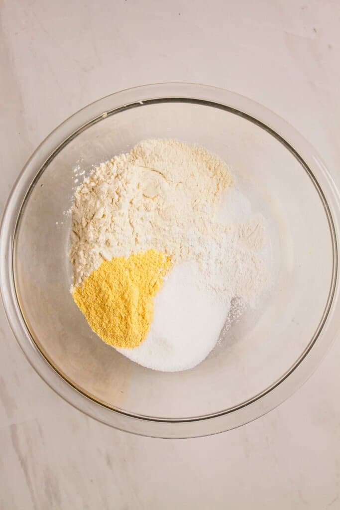 Topping being mixed in a glass bowl.