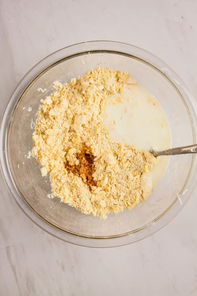 Milk being added to topping.