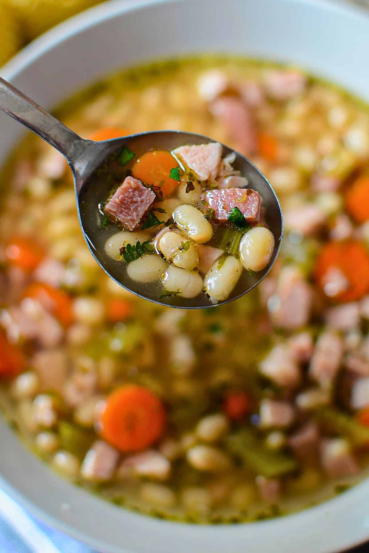 Spoonful of ham and bean soup.