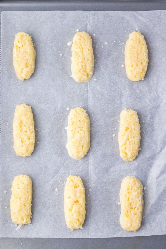 Undipped dessert on a parchment lined baking sheet.