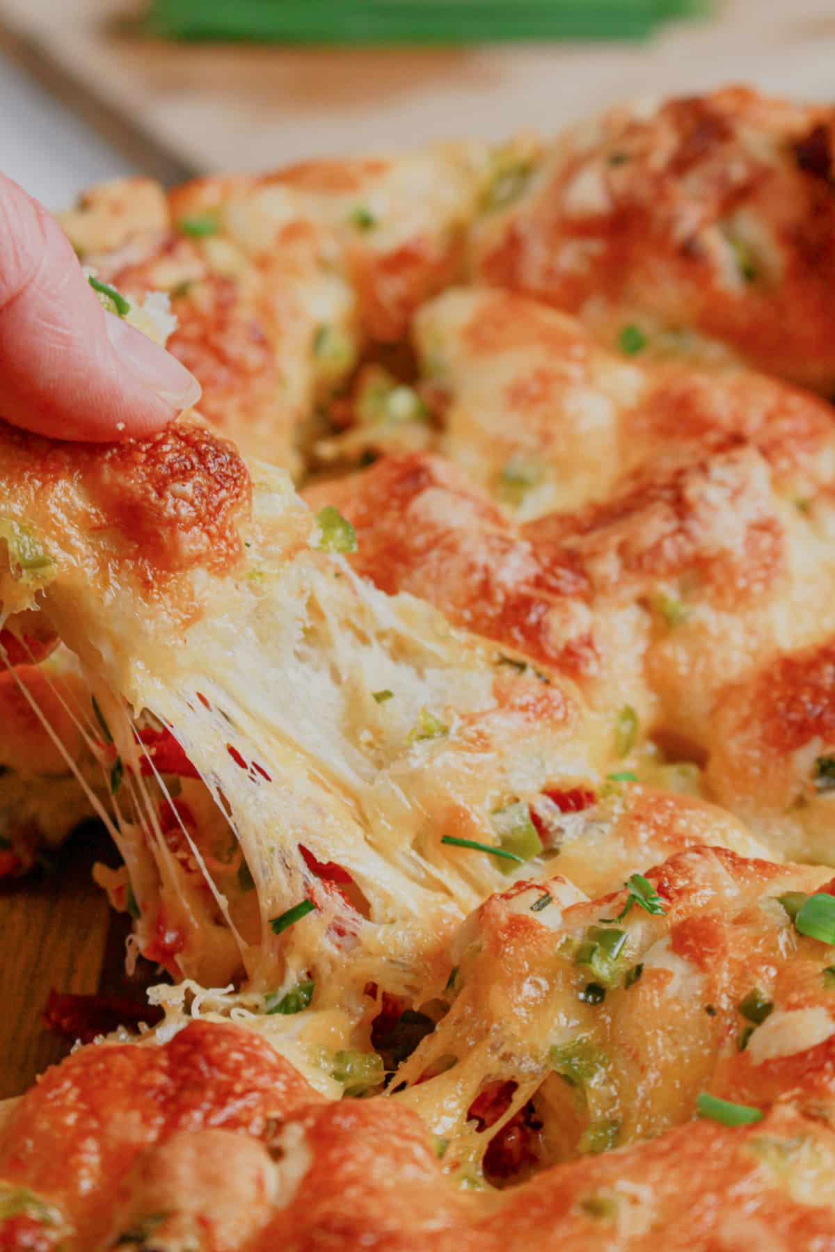 Jalapeno cheddar pull apart bread on a small plate.