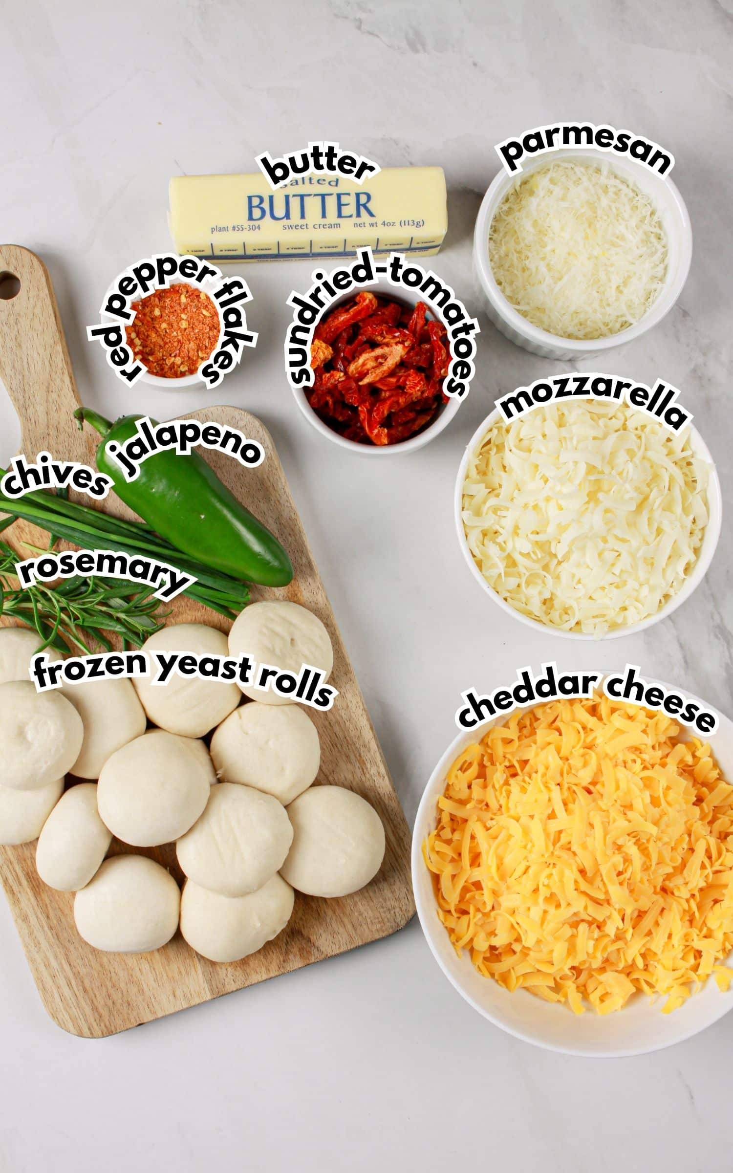 Bowls of ingredients labelled with text on a counter.