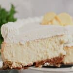 Slice of lemon cheesecake on a plate.