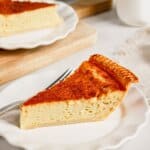 Slice of lemon custard pie on a small plate.
