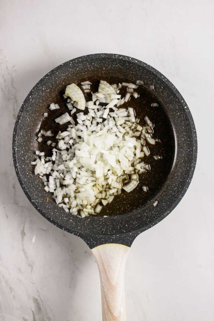 Onions added to skillet.