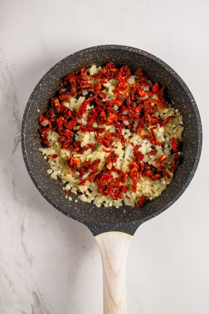 Sundried tomatoes added to skillet.