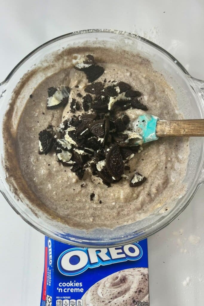 Cookies being stirred into batter.