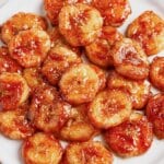 Pan fried bananas on a plate.