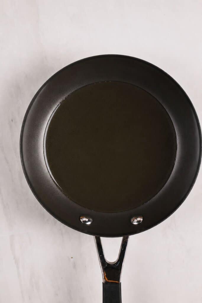 Coconut oil in a skillet.