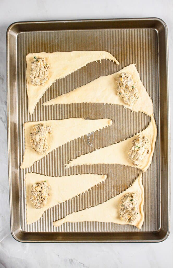 Filling being added to dough.