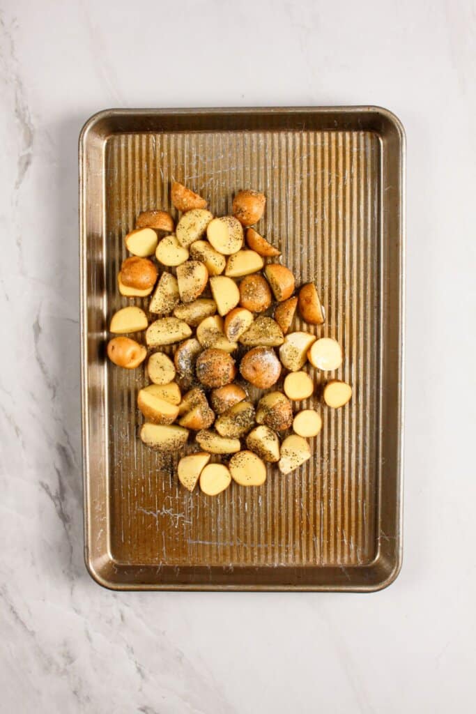 Potatoes on a baking sheet.
