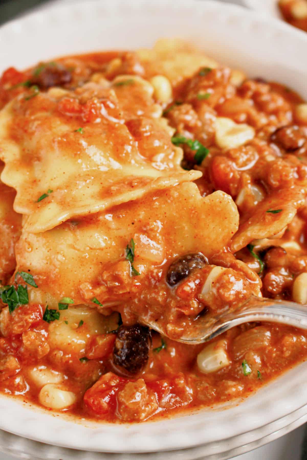 Bowl full of slow cooker taco ravioli.