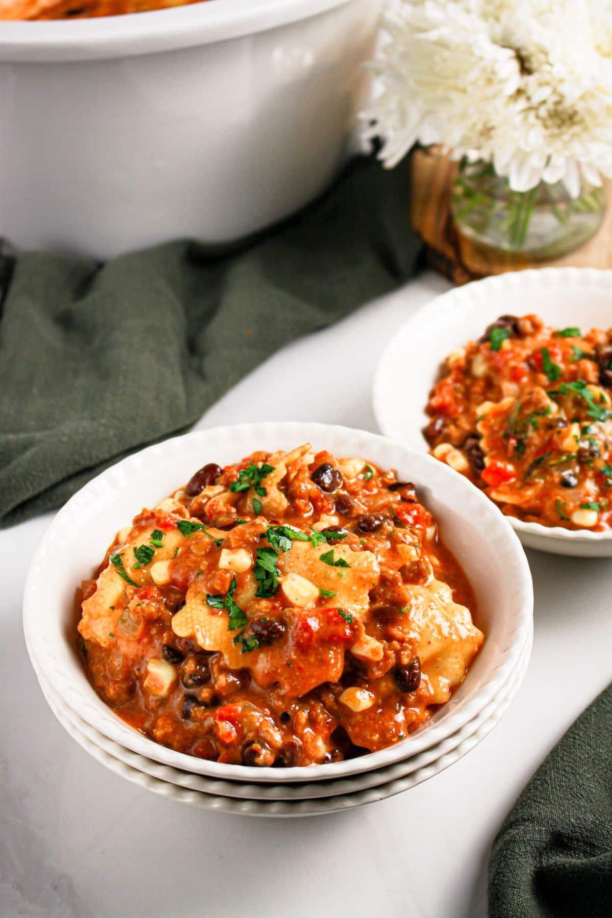 Bowl full of slow cooker taco ravioli.