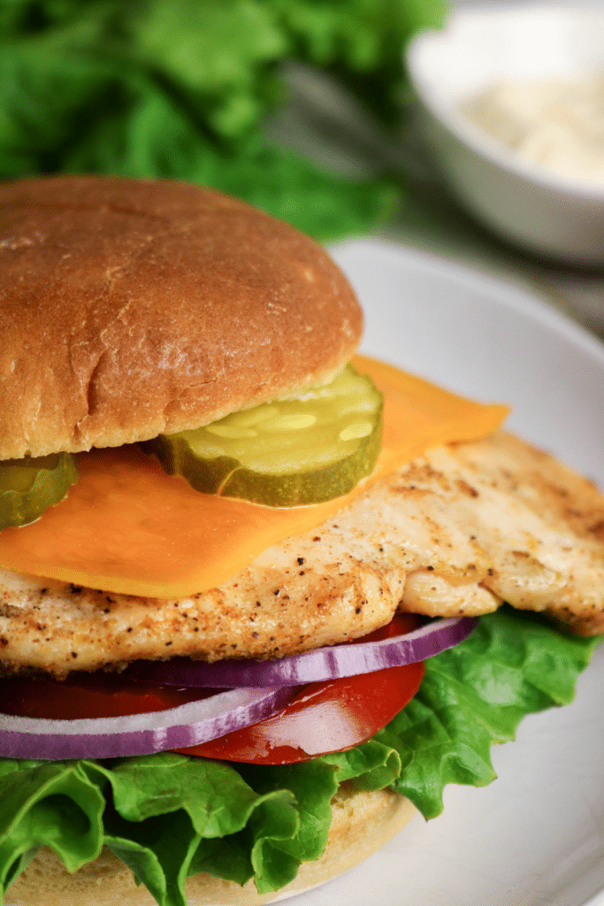 View of the onion and lettuce of the Grilled Chicken Sandwich .