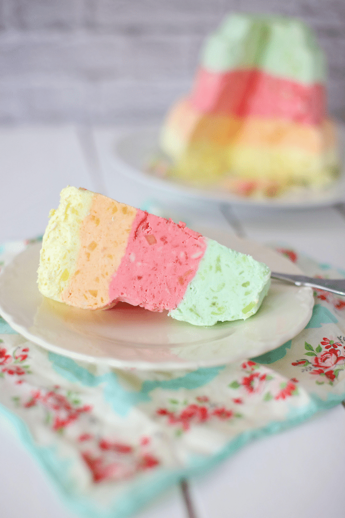 Layered jello salad on a white plate.