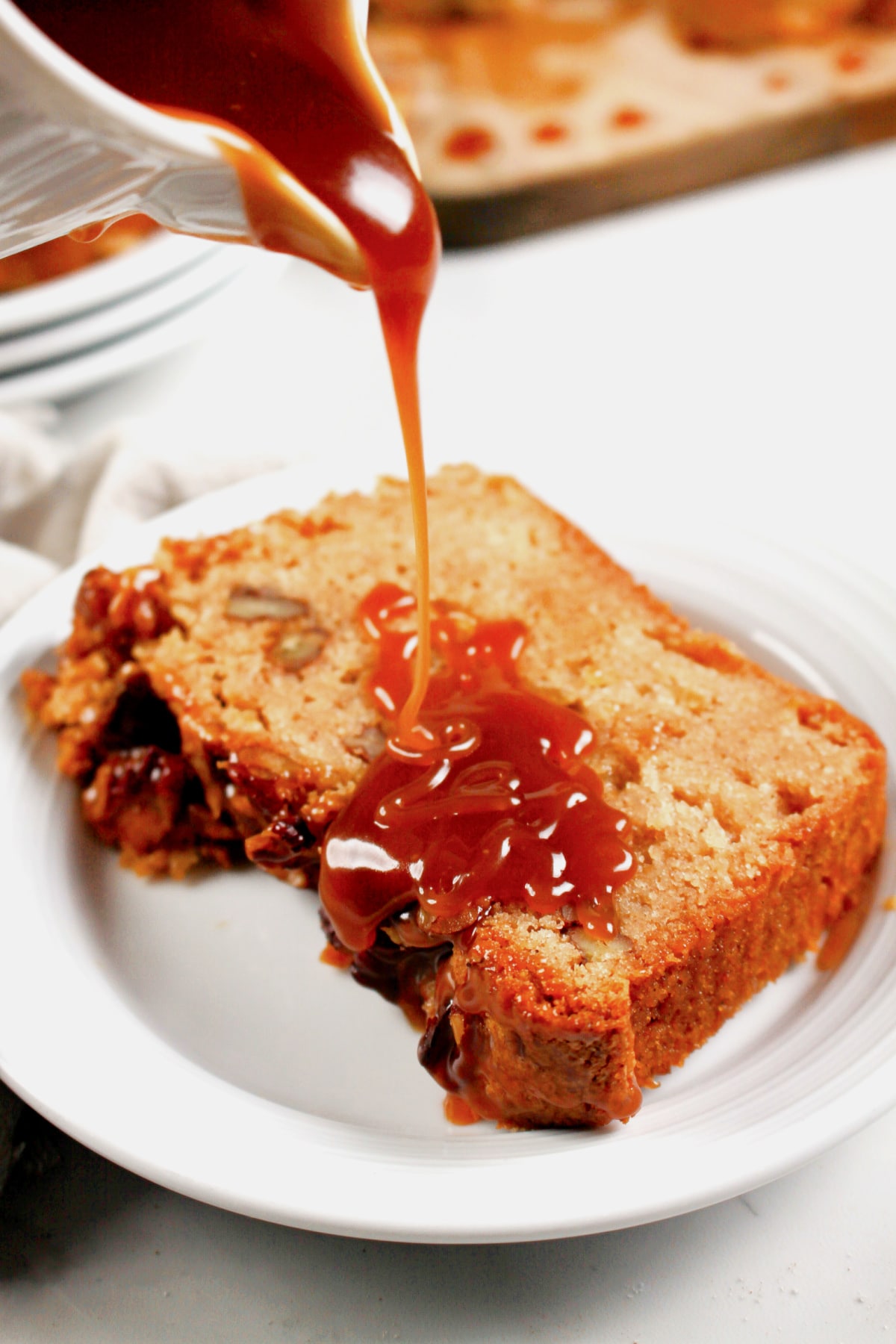 Slice of apple streusel bread on a plate.