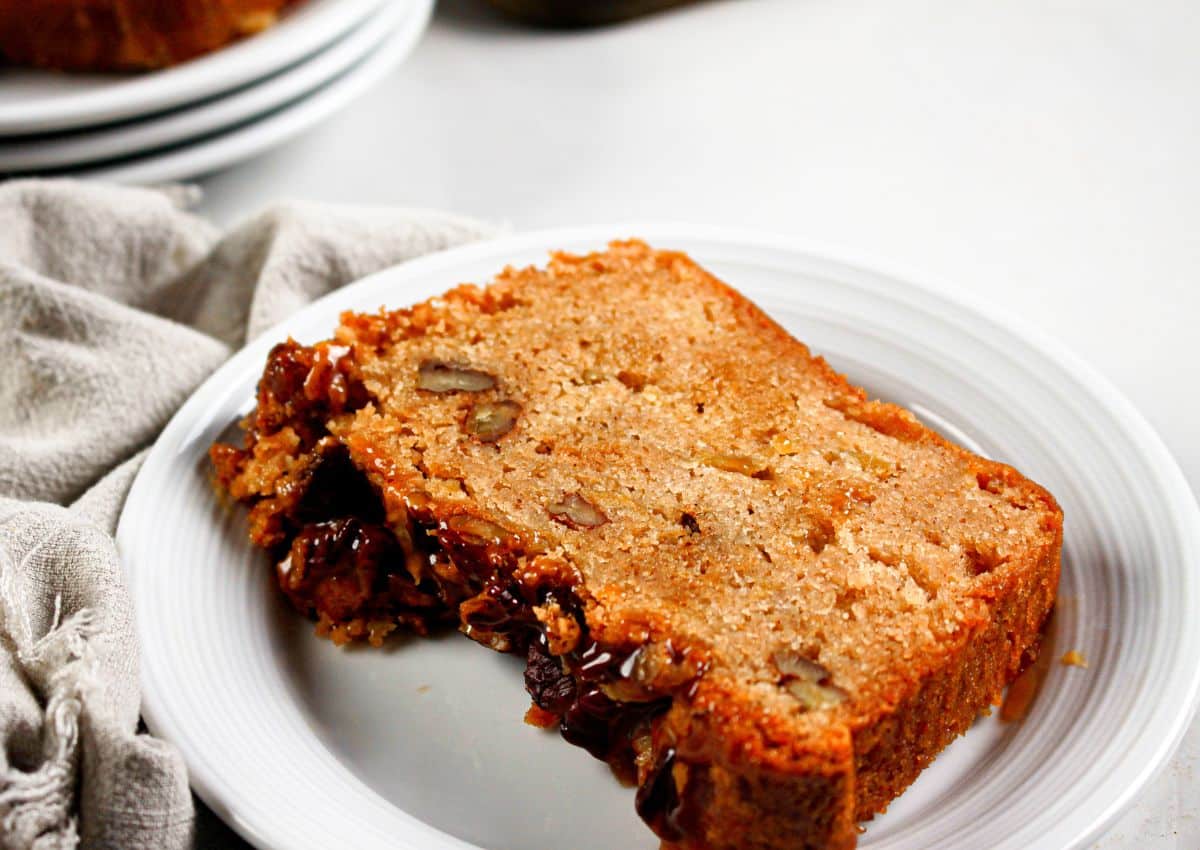 Slice of apple streusel bread on a plate.