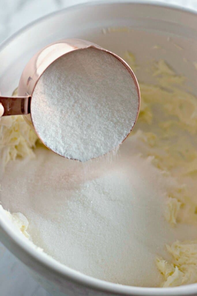 Dry ingredients being mixed into batter in a bowl.