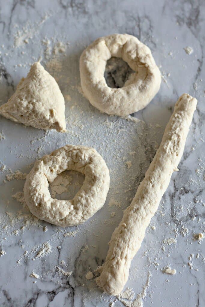 Dough being shaped into circles.