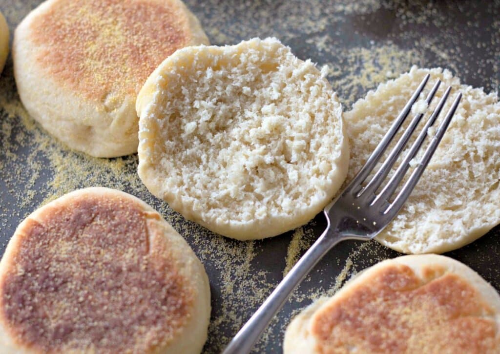 English muffin on dark baking tray.