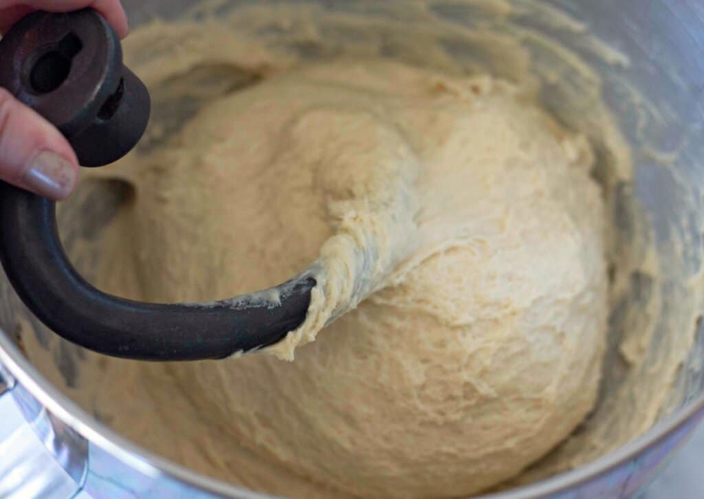 Dough being mixed in a stand mixer.