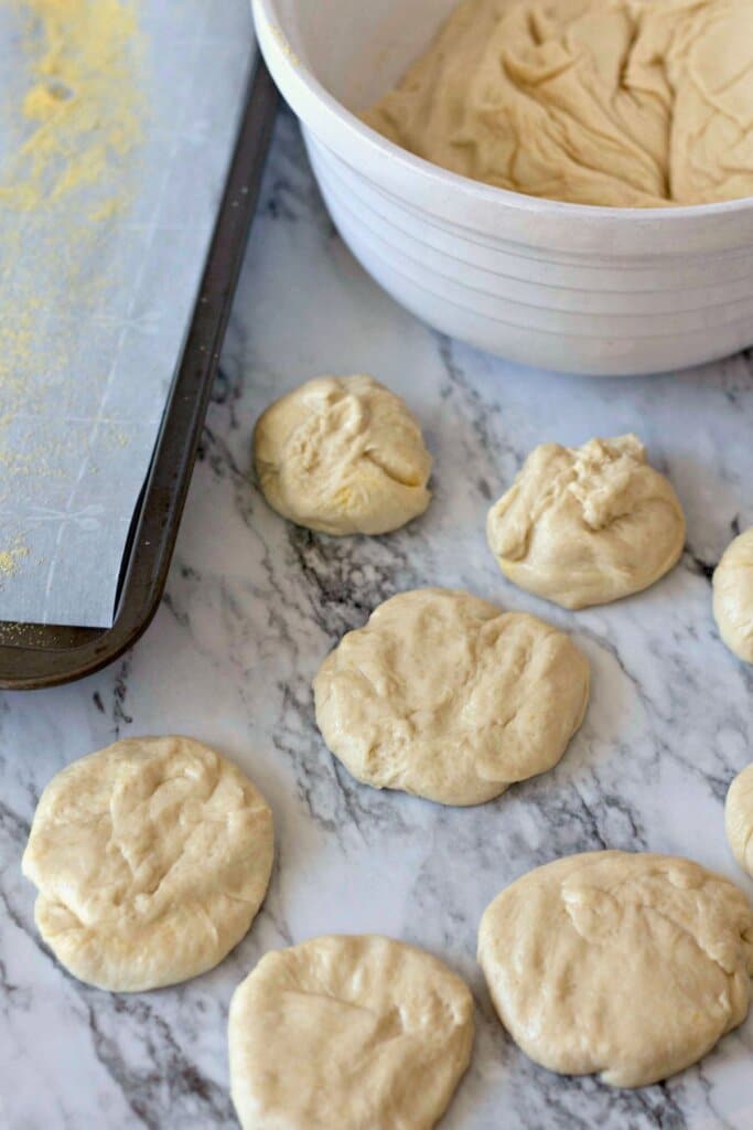 Dough being broken into balls.