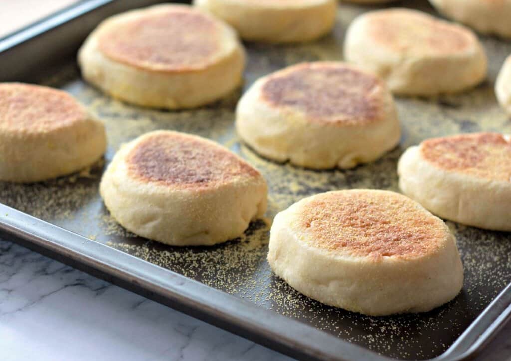 Baked goods on a dark baking sheet.