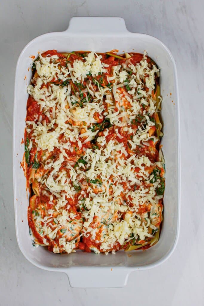 Layers of sauce and pasta in a baking dish.