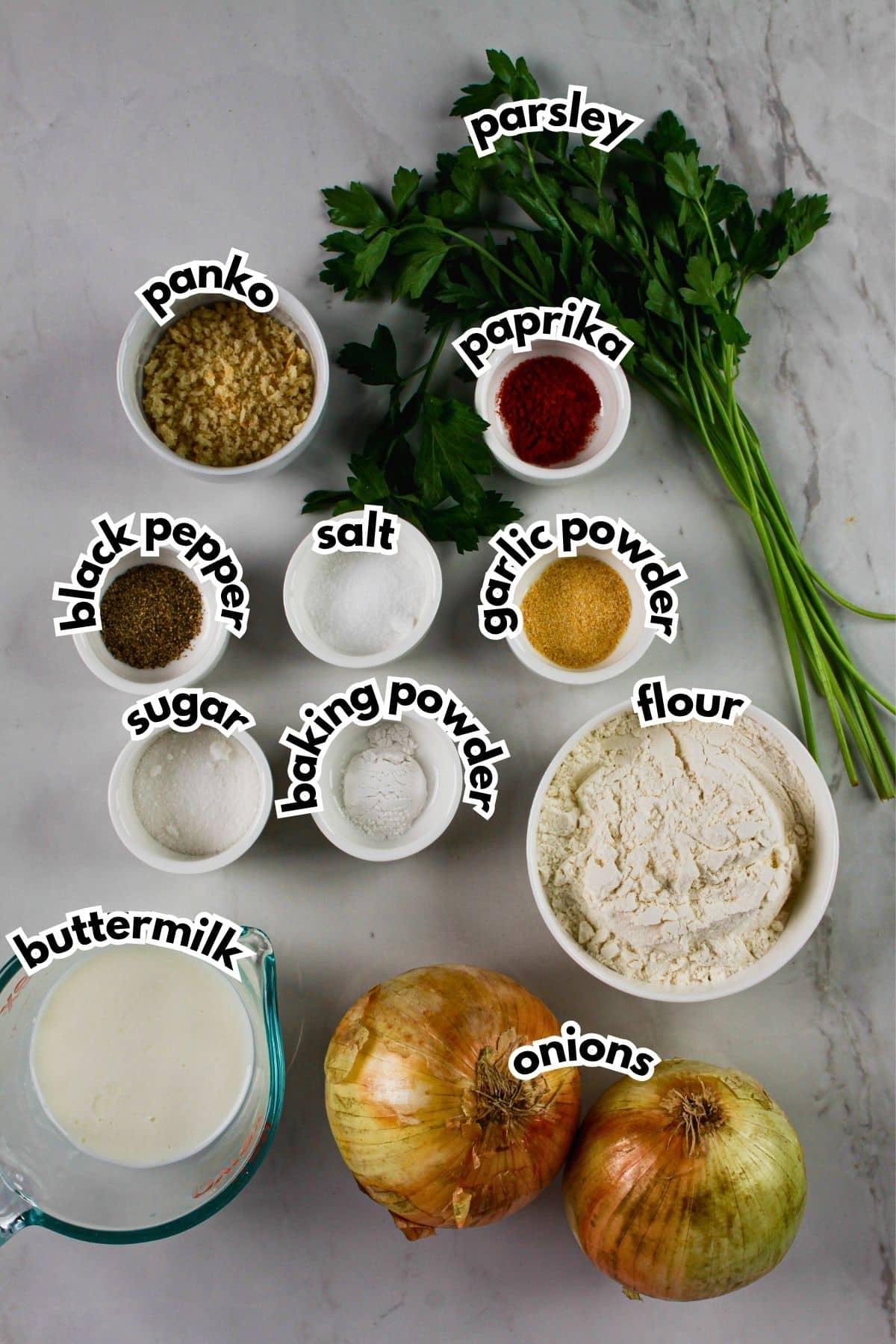 Bowl of ingredients labeled with text on a counter.