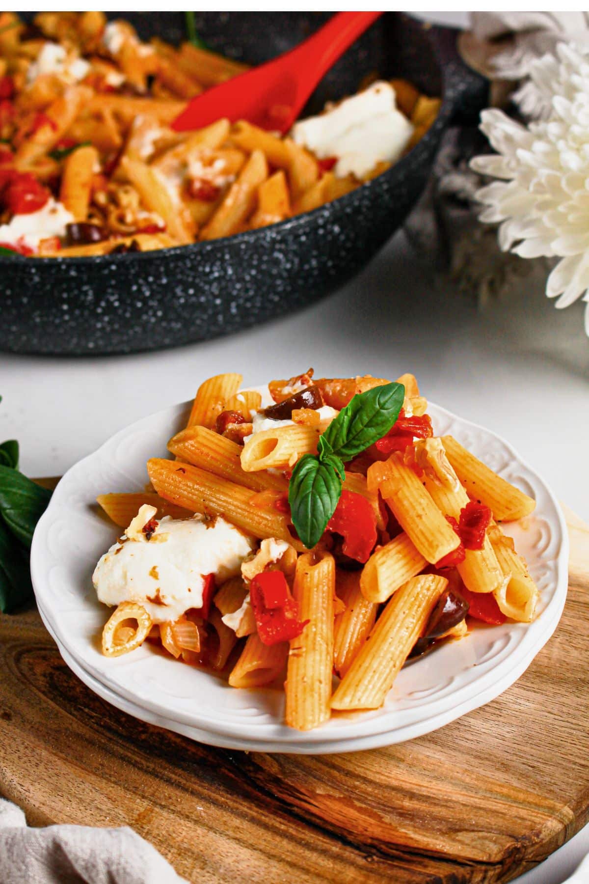 Plate full of penne napoli.