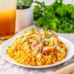 Plate of queso chicken and rice.