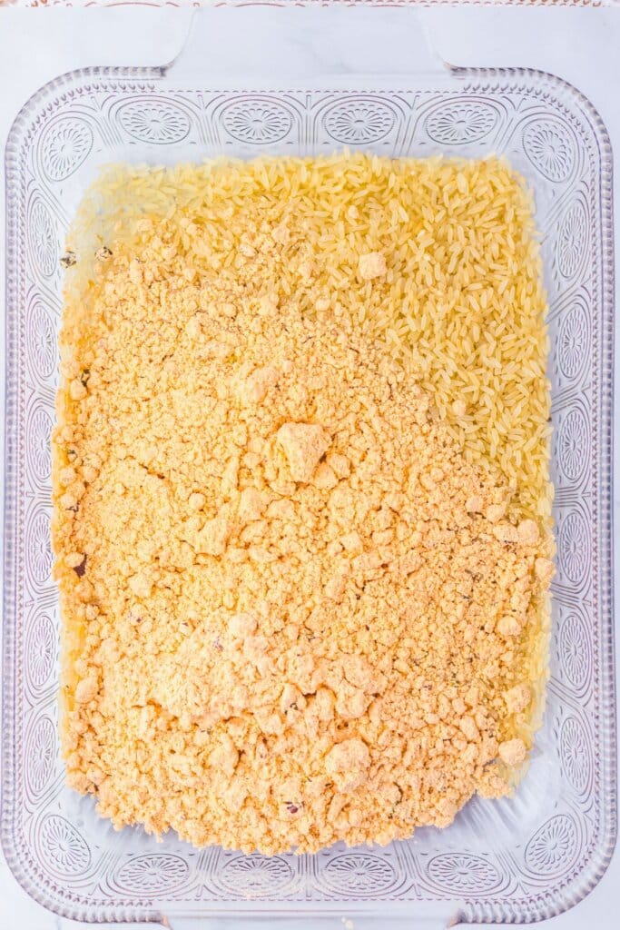 Dry grain and seasoning in a glass baking dish.